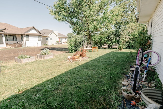 415 Swift Ave, Oglesby, IL 61348 - view of grassy yard with a vegetable garden