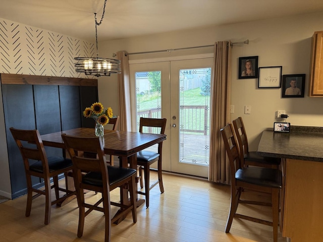 6 Kimberly Dr, Spring Valley, IL 61362 - dining room featuring french doors, a chandelier, and light wood-style floors