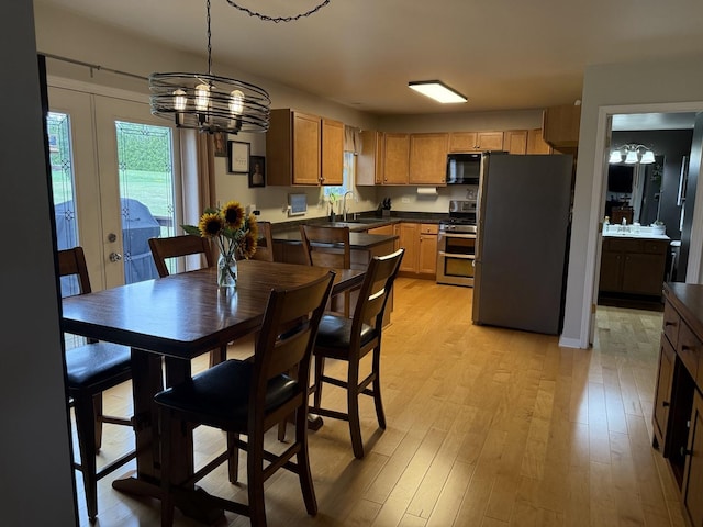 6 Kimberly Dr, Spring Valley, IL 61362 - dining area with a chandelier and light wood-style flooring
