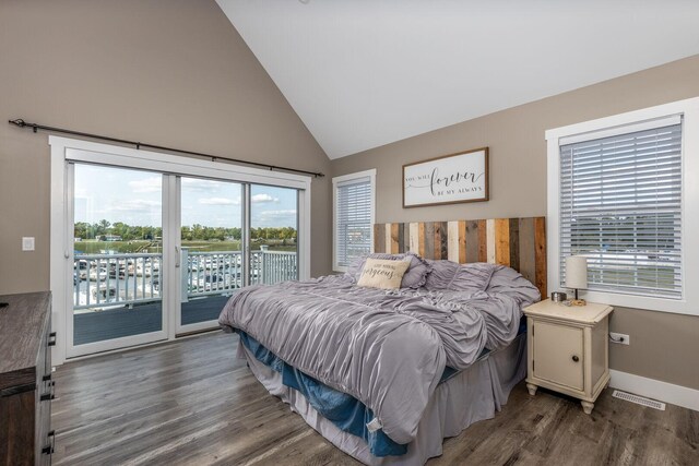 210 Leeward Way, Ottawa, IL 61350 - bedroom featuring multiple windows, access to outside, wood finished floors, and high vaulted ceiling