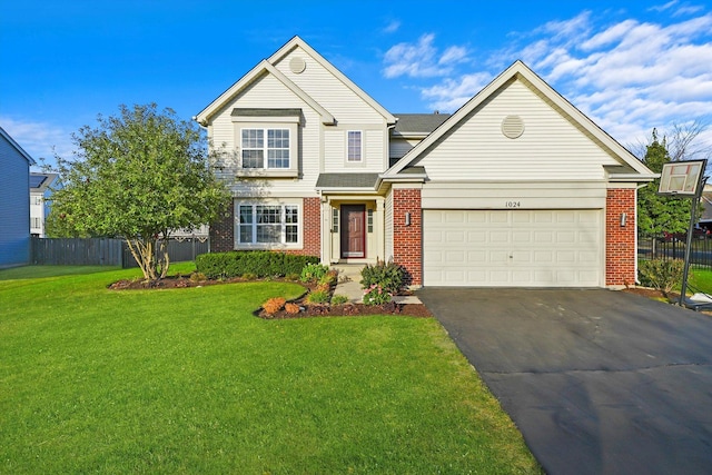 1024 Birchwood Dr, Pingree Grove, IL 60140 - traditional-style home featuring brick siding, asphalt driveway, and a garage