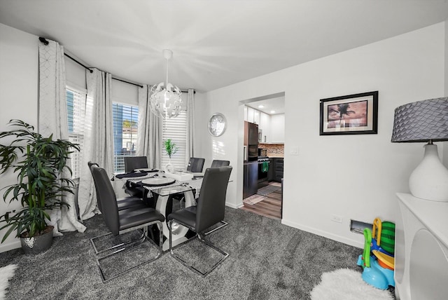 1024 Birchwood Dr, Pingree Grove, IL 60140 - dining room featuring a chandelier and dark carpet