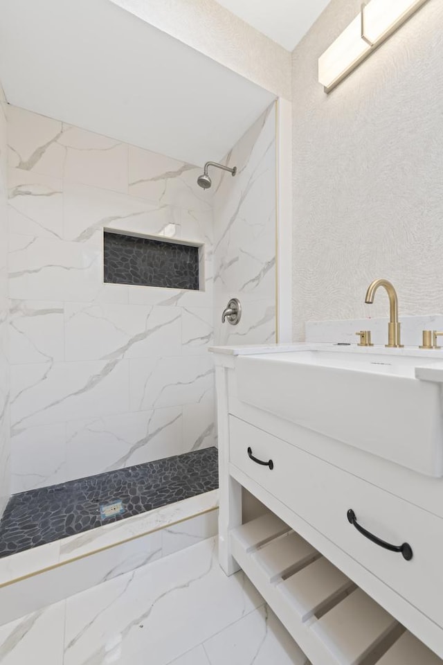 3002 Wesley Ave, Berwyn, IL 60402 - bathroom featuring a marble finish shower, marble look tiles, and vanity