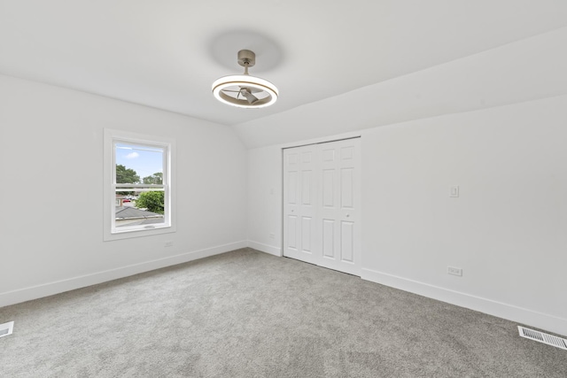 3002 Wesley Ave, Berwyn, IL 60402 - carpeted empty room with baseboards and vaulted ceiling