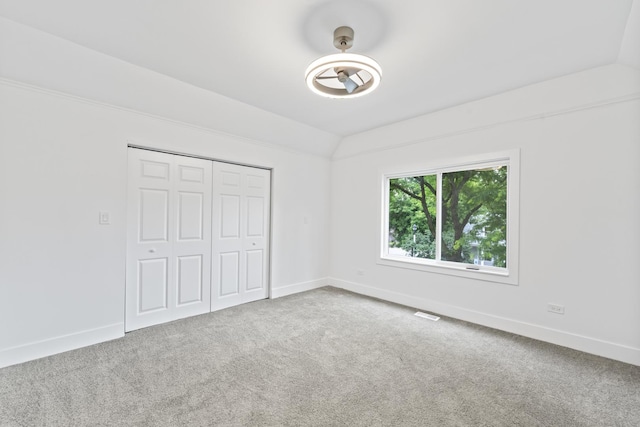 3002 Wesley Ave, Berwyn, IL 60402 - unfurnished bedroom featuring lofted ceiling, carpet flooring, and a closet