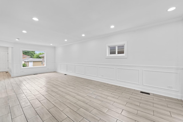 3002 Wesley Ave, Berwyn, IL 60402 - empty room with a decorative wall, ornamental molding, recessed lighting, and wainscoting