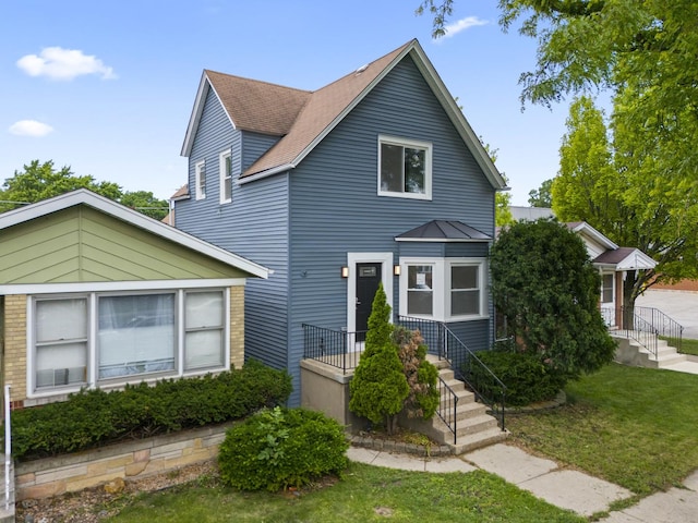 3002 Wesley Ave, Berwyn, IL 60402 - view of front facade with a metal roof and a front yard