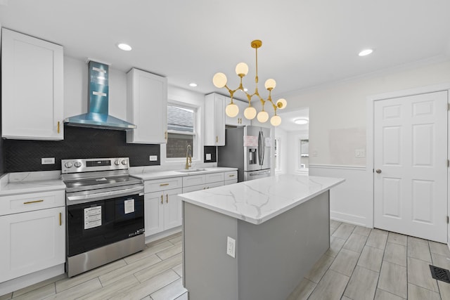 3002 Wesley Ave, Berwyn, IL 60402 - kitchen with appliances with stainless steel finishes, wall chimney range hood, white cabinets, a center island, and recessed lighting