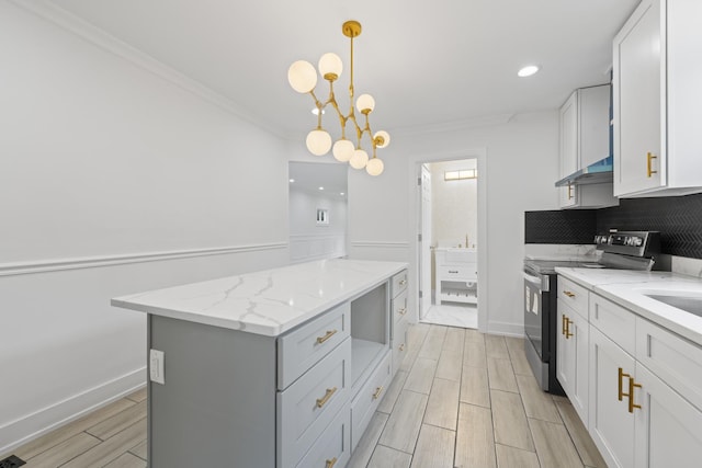 3002 Wesley Ave, Berwyn, IL 60402 - kitchen with electric stove, a kitchen island, light stone countertops, ornamental molding, and white cabinetry