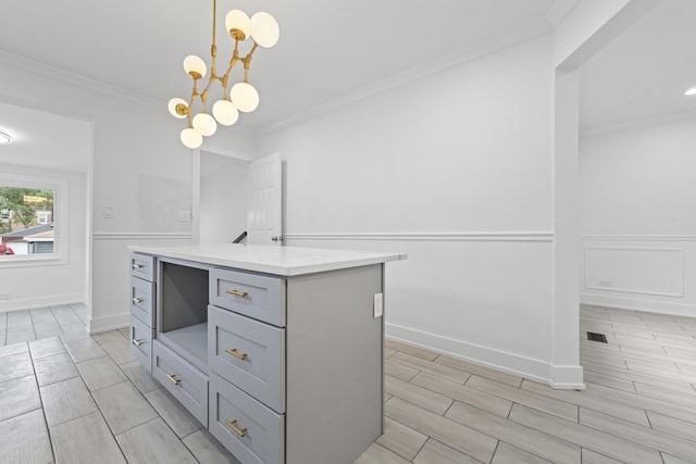 3002 Wesley Ave, Berwyn, IL 60402 - kitchen featuring gray cabinets, ornamental molding, wood tiled floors, a chandelier, and decorative light fixtures