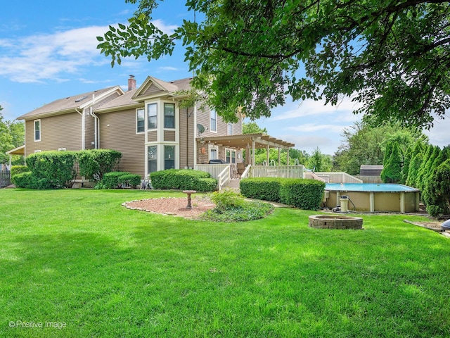 6208 Meyer Rd, Woodridge, IL 60517 - rear view of property with an outdoor pool and a yard