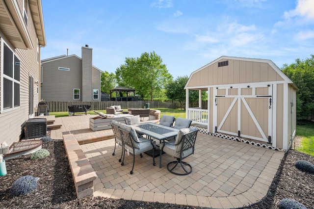1680 Rockport Rd, Hampshire, IL 60140 - fenced backyard featuring a storage shed, a patio, a gazebo, and an outdoor living space