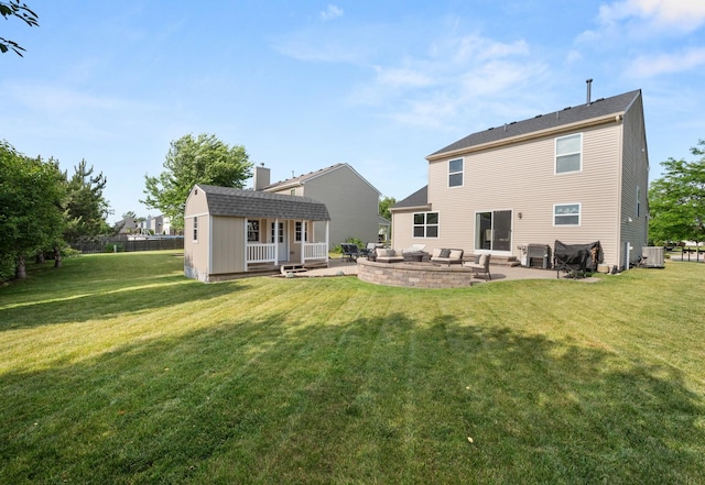 1680 Rockport Rd, Hampshire, IL 60140 - back of property with an outbuilding, a patio, a lawn, a chimney, and an outdoor hangout area