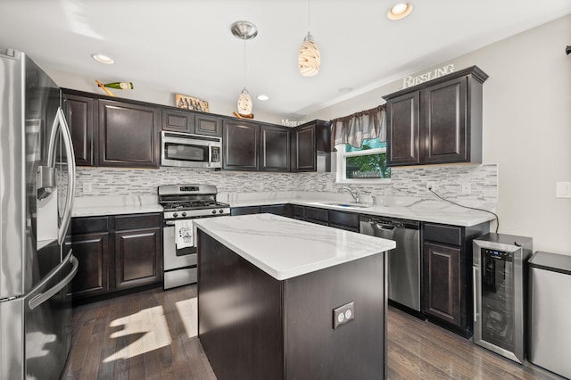 1680 Rockport Rd, Hampshire, IL 60140 - kitchen with stainless steel appliances, wine cooler, dark wood finished floors, a kitchen island, and dark brown cabinetry
