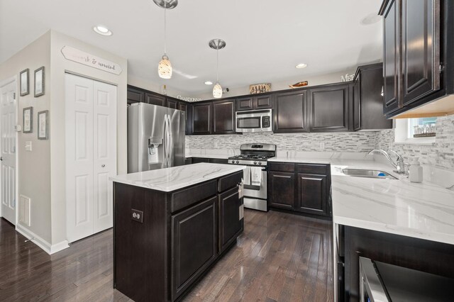 1680 Rockport Rd, Hampshire, IL 60140 - kitchen with appliances with stainless steel finishes, backsplash, dark wood finished floors, light stone countertops, and recessed lighting