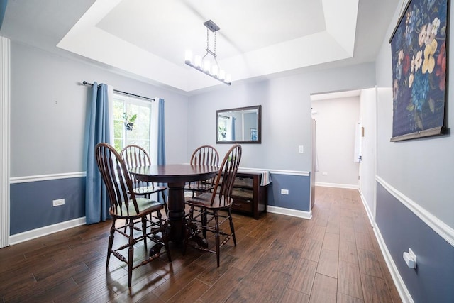2001 Jeffrey Ln, Elgin, IL 60123 - dining space featuring a tray ceiling and dark wood-type flooring