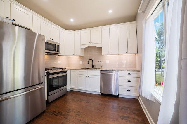 2001 Jeffrey Ln, Elgin, IL 60123 - kitchen with appliances with stainless steel finishes, decorative backsplash, dark wood-style flooring, white cabinets, and recessed lighting