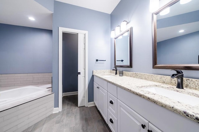 2001 Jeffrey Ln, Elgin, IL 60123 - full bath featuring double vanity, wood finished floors, and a bath