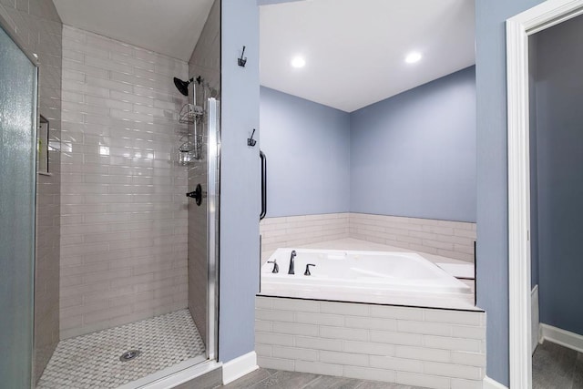 2001 Jeffrey Ln, Elgin, IL 60123 - full bath with a stall shower, a garden tub, and wood finished floors