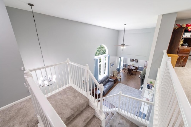 2001 Jeffrey Ln, Elgin, IL 60123 - stairway with ceiling fan, carpet floors, and a high ceiling