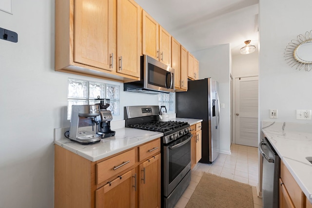 1255 N Orleans Ct Unit 1104, Chicago, IL 60610 - kitchen featuring appliances with stainless steel finishes, healthy amount of natural light, light tile patterned floors, and light stone countertops
