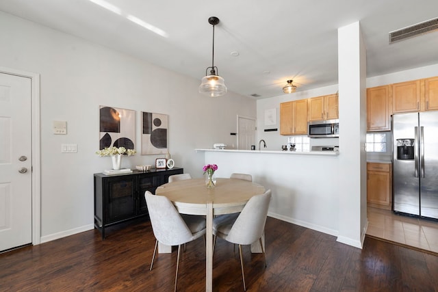1255 N Orleans Ct Unit 1104, Chicago, IL 60610 - dining space featuring dark wood-type flooring and baseboards