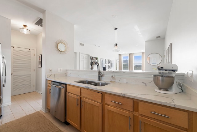1255 N Orleans Ct Unit 1104, Chicago, IL 60610 - kitchen with stainless steel appliances, light tile patterned floors, light stone countertops, pendant lighting, and brown cabinets