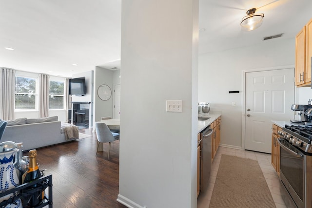 1255 N Orleans Ct Unit 1104, Chicago, IL 60610 - kitchen with appliances with stainless steel finishes, light countertops, light wood-type flooring, open floor plan, and recessed lighting