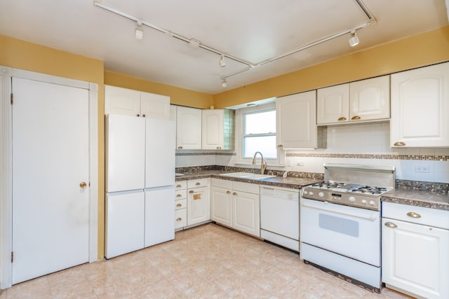 15407 Sunset Dr, Dolton, IL 60419 - kitchen with white appliances, rail lighting, dark countertops, and white cabinets