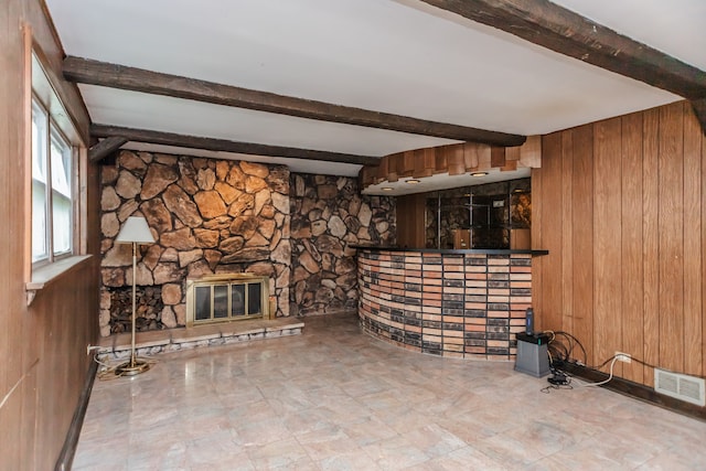 15407 Sunset Dr, Dolton, IL 60419 - unfurnished living room featuring wooden walls, beamed ceiling, and a fireplace