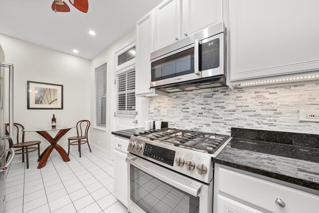 535 W Eugenie St Unit 1, Chicago, IL 60614 - kitchen with stainless steel appliances, light tile patterned flooring, white cabinetry, tasteful backsplash, and recessed lighting