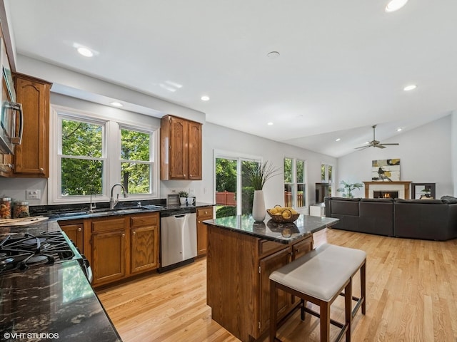 627 Williams Way, Vernon Hills, IL 60061 - kitchen with dishwasher, a kitchen island, light wood-style flooring, recessed lighting, and dark stone countertops
