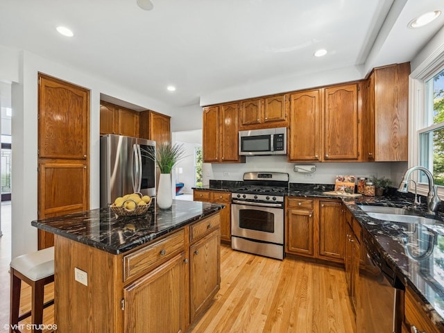 627 Williams Way, Vernon Hills, IL 60061 - kitchen featuring stainless steel appliances, light wood-style floors, brown cabinets, dark stone countertops, and recessed lighting