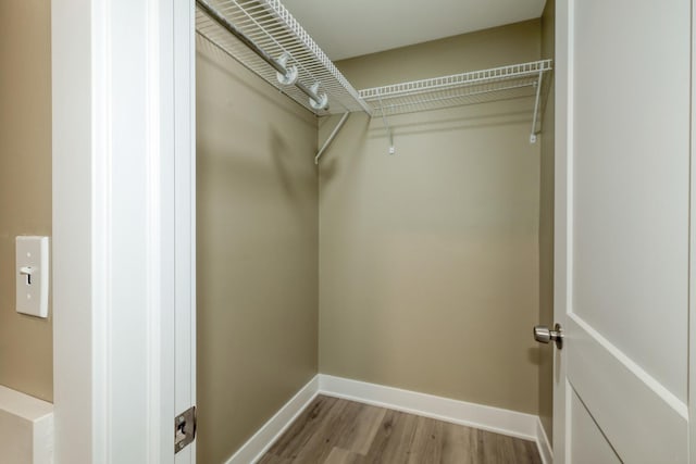 362 Springlake Ln Unit C, Aurora, IL 60504 - walk in closet featuring wood finished floors