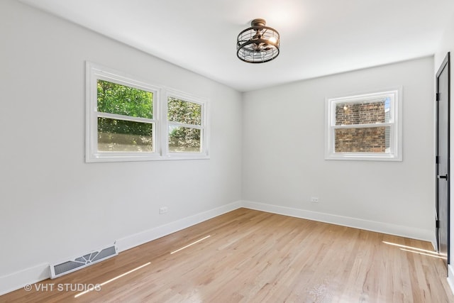 1575 Burning Trl, Wheaton, IL 60189 - unfurnished room featuring baseboards and light wood-type flooring