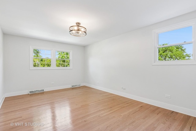 1575 Burning Trl, Wheaton, IL 60189 - unfurnished room featuring a chandelier and light wood finished floors