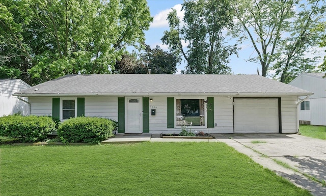 2009 E Michigan Ave, Urbana, IL 61802 - ranch-style home with a garage, concrete driveway, a front lawn, and a shingled roof