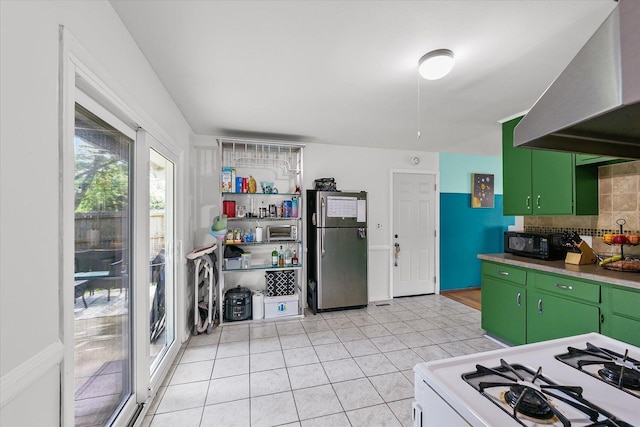 2009 E Michigan Ave, Urbana, IL 61802 - kitchen with freestanding refrigerator, ventilation hood, black microwave, white range with gas stovetop, and green cabinets