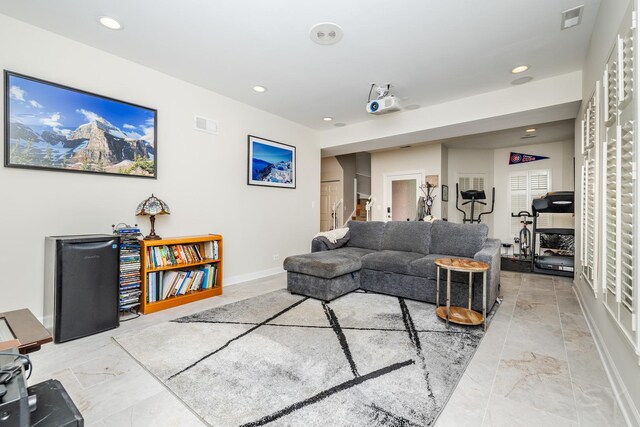 909 W Village Ct, Chicago, IL 60608 - living room with recessed lighting and light marble finish flooring