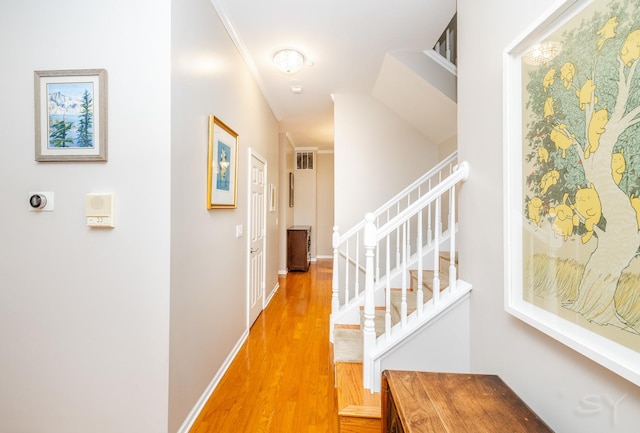 909 W Village Ct, Chicago, IL 60608 - corridor featuring light wood-style floors, stairs, and crown molding