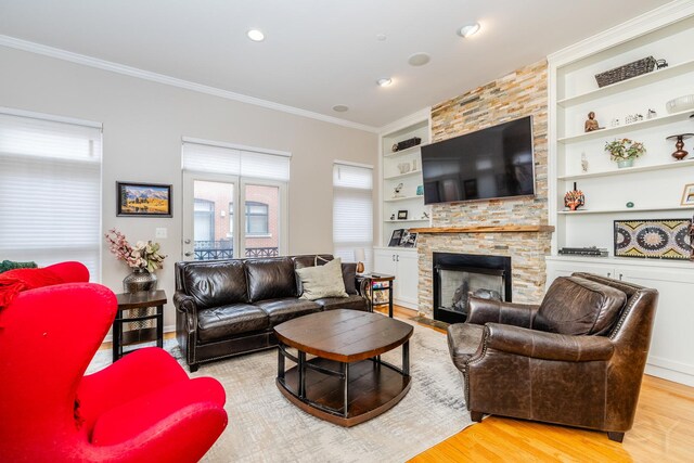 909 W Village Ct, Chicago, IL 60608 - living area with wood finished floors, built in features, crown molding, a fireplace, and recessed lighting