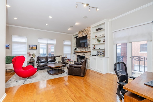 909 W Village Ct, Chicago, IL 60608 - living area featuring light wood-style floors, recessed lighting, ornamental molding, built in features, and a fireplace