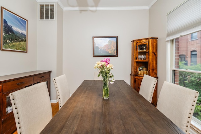 909 W Village Ct, Chicago, IL 60608 - dining space with crown molding, plenty of natural light, and wood finished floors