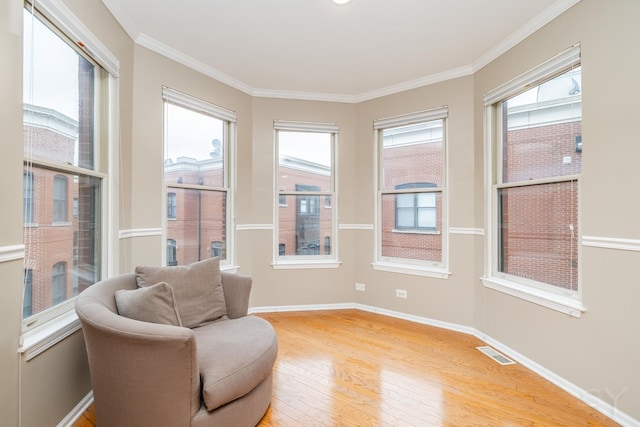 909 W Village Ct, Chicago, IL 60608 - sitting room featuring light wood-type flooring and ornamental molding