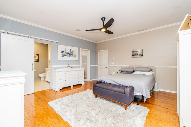 909 W Village Ct, Chicago, IL 60608 - bedroom with light wood-style flooring, crown molding, ensuite bathroom, a ceiling fan, and a barn door