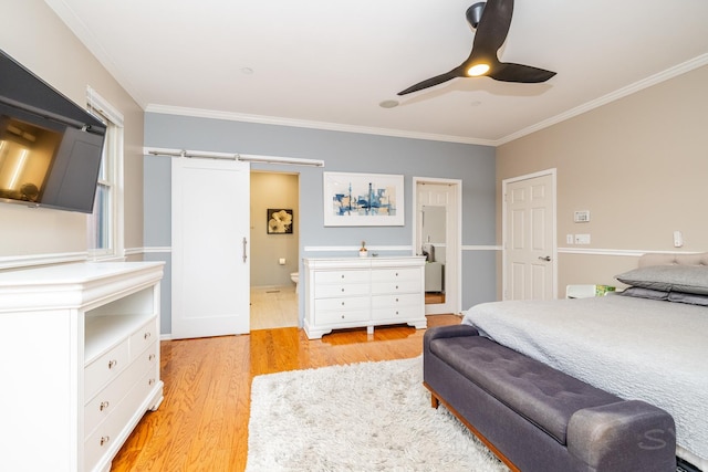 909 W Village Ct, Chicago, IL 60608 - bedroom with ornamental molding, light wood finished floors, ceiling fan, a barn door, and ensuite bath