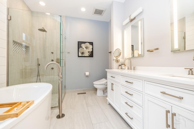 909 W Village Ct, Chicago, IL 60608 - full bath featuring a freestanding bath, a shower stall, double vanity, and recessed lighting