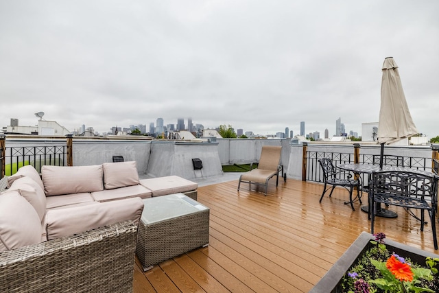 909 W Village Ct, Chicago, IL 60608 - wooden deck featuring outdoor lounge area, a view of skyline, and outdoor dining area