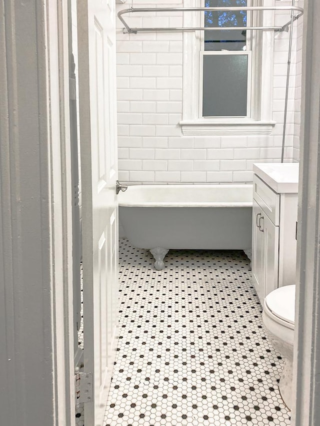 2641 W Thomas St, Chicago, IL 60622 - full bathroom featuring a tub, vanity, a shower, and tile patterned flooring