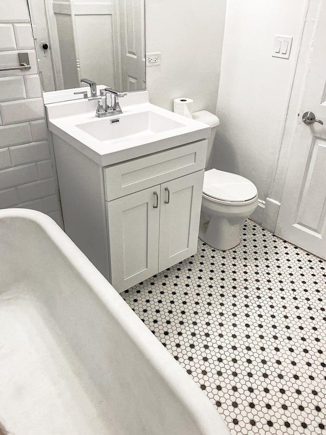 2641 W Thomas St, Chicago, IL 60622 - bathroom with vanity, tile patterned floors, and a bathtub